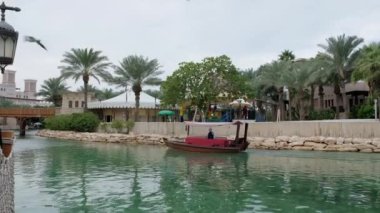 Abra boat tour on the water canal at Souk Madinat Jumeirah. Editorial taken 31 December 2022