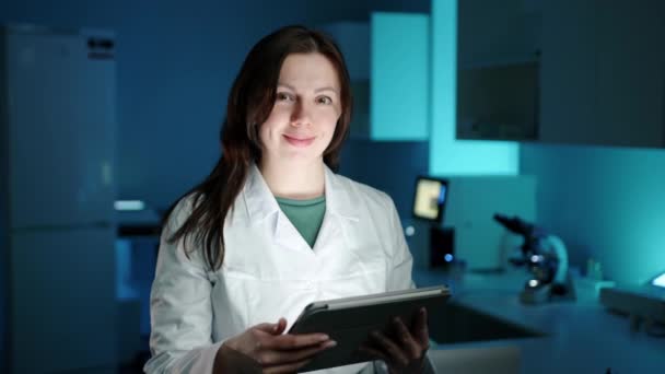 Female Doctor Dark Laboratory Working Tablet Computer Looking Smile She — Stock Video