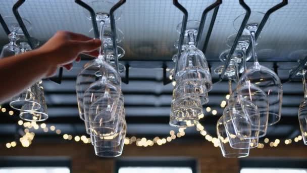 Clean Wine Glasses Hanging Upside Bar Rack Restaurant Slow Motion — Stock Video
