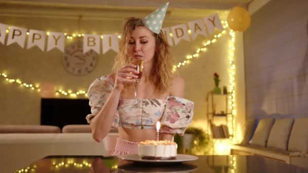 Woman Nice Dress Party Cap Drinking Champagne Blowing Candles Woman — Stock Video