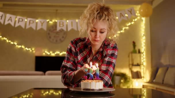 Sad Woman Lookinga Candles Cake Blowing Them Out Candles Birthdayt — Stock Video