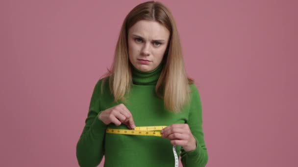 Young Caucasian Woman Feeling Depressed While Measuring Her Chest Portrait — Stock Video