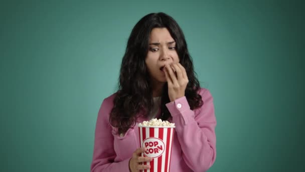 Girl Puzzled Look Watches Movie She Has Popcorn Her Hands — Stock Video