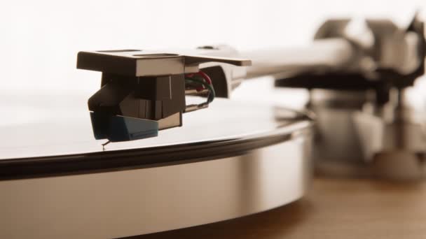 Vinyl Player Stylus Touches Spinning Record Player Soft Light Illuminates — Stock Video