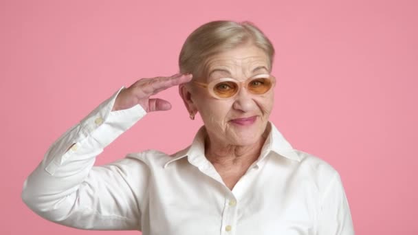 Old Blonde Woman Short Hair Light Make Standing Pink Background — Stock Video