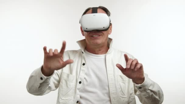 Excited Middle Aged Man Virtual Reality Headset Gesturing Interacting Unseen — Stock Video