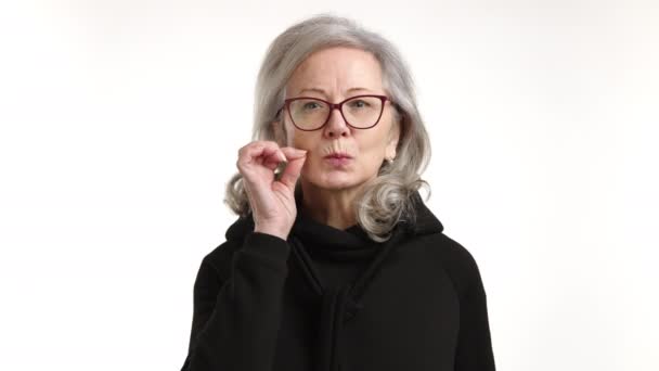Senior Woman Finger Her Lips Gesturing Silence Playful Secretive Manner — Stock Video