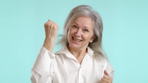 Mature Businesswoman Raises Her Fist Triumphant Gesture Her Face Expressing — Stock Video