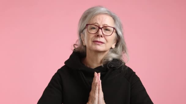 Mature Womans Clasped Hands Implore Earnestly She Looks Embodying Hope — Stock Video
