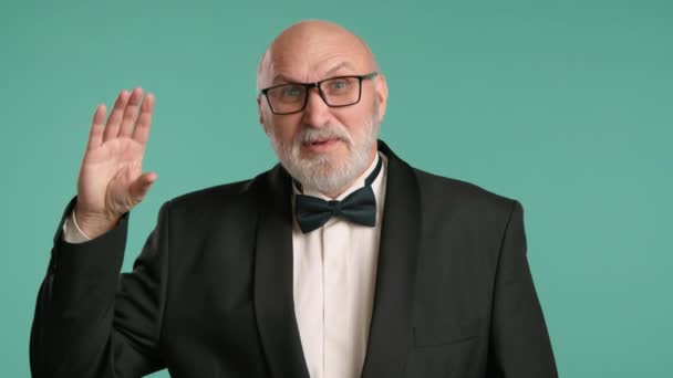 Senior Man Formal Black Suit Bowtie Gestures His Hand Symbolizing — Stock Video