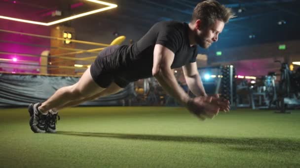 Male Athlete Performs Clap Push Ups Intense Focus Highlighted Gyms — Stock Video