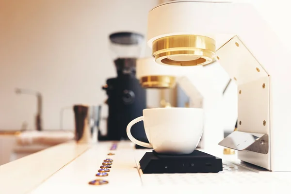 espresso machine in restaurant counter with white small cup