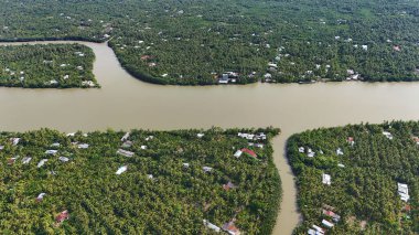 Amazing aerial view of Mekong Delta, vast coconut, palm, nipa tree field, irrigation system by canal with many river branch, water source for agriculture and waterway transport with cheap clipart