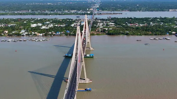 stock image Aerial view of Rach Mieu Bridge cross Tien river, link Tien Giang with Ben Tre, cable stayed bridge at Mekong Delta, boat traffic on water, vehicle on road
