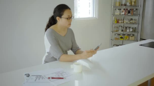 Asian Woman Eyeglasses Phone Home — Stock Video