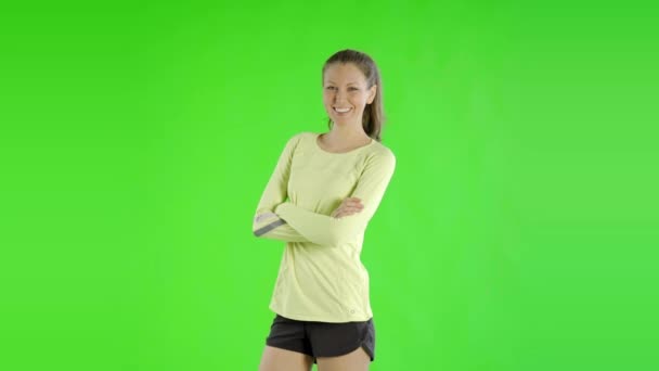 Junge Schöne Frau Trägt Sportbekleidung Auf Grünem Bildschirm — Stockvideo