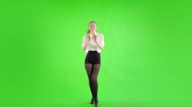 woman dancing tap dance on green background 
