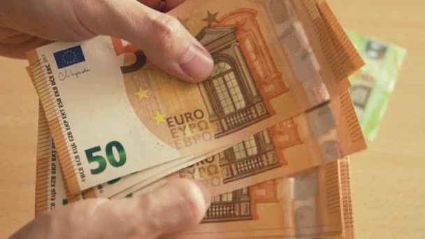 Counting Fifty Euros Banknotes Yellow Desk Caucasian Hands — Vídeo de Stock