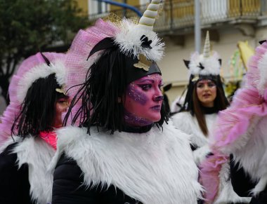 Rijeka, Croatia, 19th February, 2023. Face of a beautiful young woman with make up in a unicorn costume close up