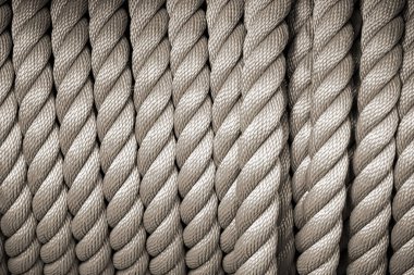 Bej renkli soyut arkaplanda sarmal doğal pamuk ip