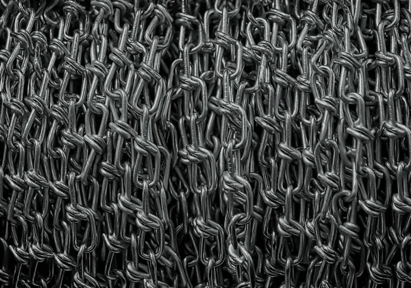 Iron net from dark metal chains abstract background