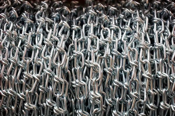 Silver metal chain net close up abstract background