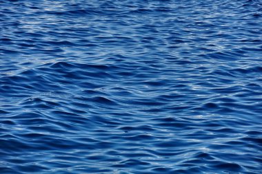 Wavy surface with rippled waves and light reflection on the top clipart