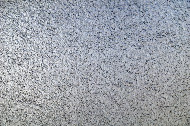 Siyah noktalarla benekli beyaz duvar yüzeyi yakın görünüm