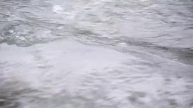 Mountain river with clear water from melting snow and ice