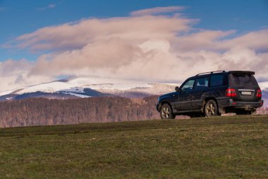 SUV travels the spring Carpathians