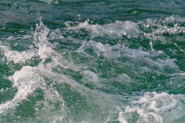 Mountain river with clear water from melting snow and ice