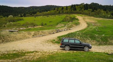 SUV travels the spring Carpathians