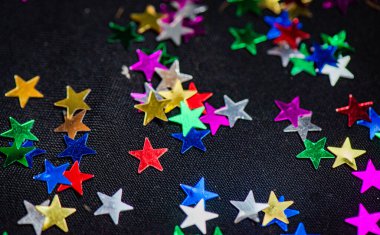 Tatil arkaplanı için dokusu çok renkli parlak yıldızlar