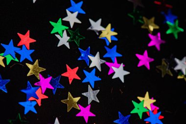 Tatil arkaplanı için dokusu çok renkli parlak yıldızlar