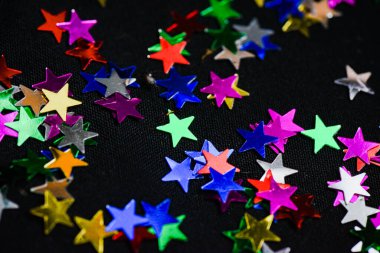 Tatil arkaplanı için dokusu çok renkli parlak yıldızlar