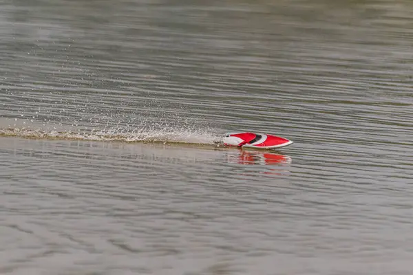 stock image A radio controlled boat floats in the lake