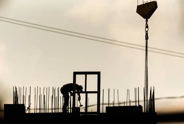 stock image Outlines of builders on a city construction site