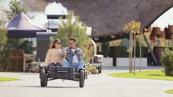 Front View Young Couple Driving Buggy Looking Each Other Hugging — Vídeos de Stock