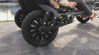 Close up of two young people spending time at nature together. Carefree couple driving buggy, car, enjoying speed, active rest, traveling.Concept of active recreation and speed.