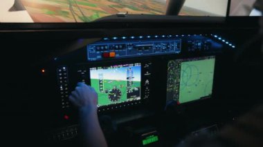 Close up of female pilot sitting in cabin, switching, turning buttons. Woman wearing uniform launching airplane, looking at screen, flying aircraft. Concept of aviation.