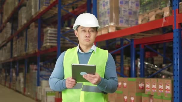 Focused Male Worker Standing Industrial Storage Typing Digital Tablet Asian — Stock Video