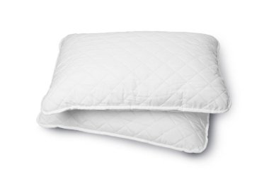 Otelde ya da otel odasında beyaz alerjik olmayan yastık beyaz arka planda kırpma yolu ile izole edilmiştir..