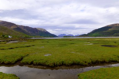 Leven Gölü denize açılıyor, Glencoe 'nun batısında, İskoçya İskoçya' da. Manzara gelgitlerin davranışlarıyla şekillenir..