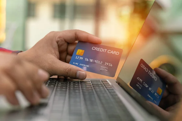 Business man use Credit card for Shopping online, Asia man use computer meeting with team for contact project business technology, financial business man.