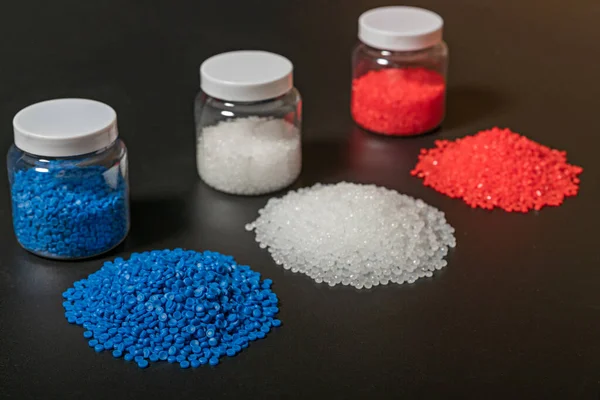 Close-up of plastic polymer granules. hand hold Polymer pellets. polymer plastic. compound polymer. Bio plastic.