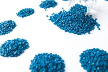 Blue plastic grain, plastic polymer granules,hand hold Polymer pellets, Raw materials for making water pipes, Plastics from petrochemicals and compound extrusion, resin from plant polyethylene. clipart