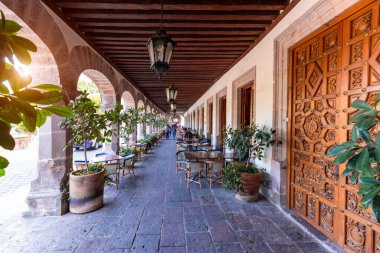 Mexico, Morelia tourist attraction colorful streets and restaurants in historic center.
