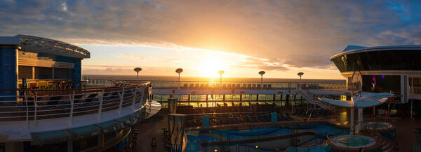 Panoramic ocean view with luxury cruise ship heading to vacation from Seattle to Alaska.