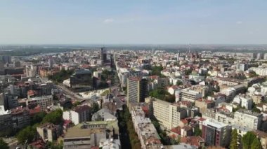 Belgrade, Serbia. Drone Aerial View, Cityscape Skyline Traffic on Slavija Square Buildings and Danube and Sava River in Background on Sunny Summer Day