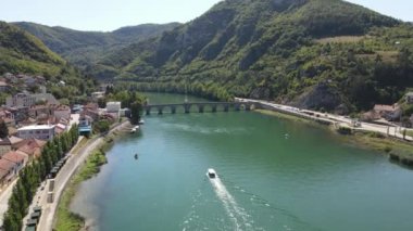 Visegrad, Drina River and Old Stone Bridge. Drone Aerial View of 16th Century Landmark and Unesco World Heritage Site on Sunny Summer Day, Bosnia and Herzegovina 4k